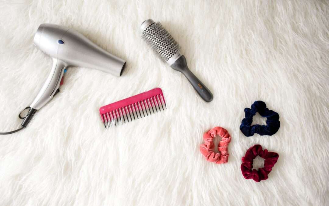 grey hair blower near pink hair combs and scrunchies