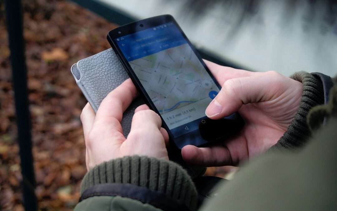person using google maps application through black android smartphone